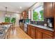 Kitchen featuring wooden cabinets, granite countertops, and stainless steel appliances at 7126 E 162Nd Ct, Brighton, CO 80602