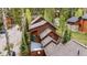 Aerial shot of an attractive home featuring a deck and nestled among trees at 1152 Ski Hill Rd, Breckenridge, CO 80424