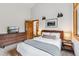 Bedroom with dresser and mounted TV at 1152 Ski Hill Rd, Breckenridge, CO 80424