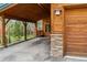 Charming wood cabin featuring a covered carport, garage and stone accents on the exterior at 1152 Ski Hill Rd, Breckenridge, CO 80424