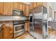Well-equipped kitchen with stainless steel appliances and warm wood cabinetry at 1152 Ski Hill Rd, Breckenridge, CO 80424