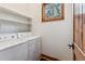 Bright laundry room with side by side washer and dryer at 1152 Ski Hill Rd, Breckenridge, CO 80424