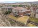 Expansive backyard and brick home can be seen in this aerial view at 132 Loveland Way, Golden, CO 80401