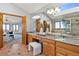 Primary bathroom suite featuring double sinks, a soaking tub, and a glass shower at 132 Loveland Way, Golden, CO 80401