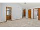 Spacious bedroom with an attached bathroom, closet, and built-in shelves at 132 Loveland Way, Golden, CO 80401