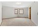 Spacious bedroom featuring neutral walls, carpeted floors, and windows with wood trim at 132 Loveland Way, Golden, CO 80401