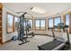 Bright exercise room featuring an elliptical and a weight machine with scenic views at 132 Loveland Way, Golden, CO 80401