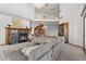 Bright living room features a cozy fireplace, chandelier, curved stairway, and natural light at 132 Loveland Way, Golden, CO 80401