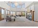 Spacious living room with high ceilings, a fireplace, large windows, and ample seating for entertaining at 132 Loveland Way, Golden, CO 80401