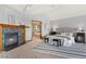 Comfortable main bedroom featuring a fireplace and a luxury ensuite bathroom at 132 Loveland Way, Golden, CO 80401