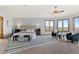 Bright main bedroom with sitting area and a wall of windows offering exterior views at 132 Loveland Way, Golden, CO 80401