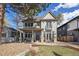 Charming two-story home with a welcoming front porch and landscaped yard at 2486 S Monroe St. St, Denver, CO 80210