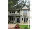 Charming two-story home featuring a welcoming front porch and a Juliet balcony at 2486 S Monroe St. St, Denver, CO 80210