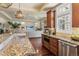 Stylish kitchen with granite countertops, stainless steel appliances, and a smooth transition to the living room at 2486 S Monroe St. St, Denver, CO 80210