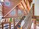 Unique attic with log beams, stylish staircase and natural lighting at 1000 Lodgepole Dr, Evergreen, CO 80439