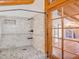 Shower room tiled in neutral colors featuring a glass door for natural light at 1000 Lodgepole Dr, Evergreen, CO 80439
