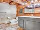 Bathroom features stone floors, log walls, and a modern vanity at 1000 Lodgepole Dr, Evergreen, CO 80439