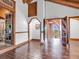 Open entryway leads to multiple rooms, showcasing the log cabin's design at 1000 Lodgepole Dr, Evergreen, CO 80439