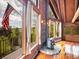Bright interior featuring wood floors, a stone fireplace, large windows with views, and vaulted ceilings at 1000 Lodgepole Dr, Evergreen, CO 80439