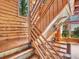 Wooden staircase showcases craftmanship and leads to the living areas at 1000 Lodgepole Dr, Evergreen, CO 80439