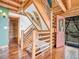 Unique wooden staircase with decorative snowshoes provides access to upper floors at 1000 Lodgepole Dr, Evergreen, CO 80439