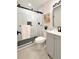 Updated bathroom featuring a glass door shower with matte black hardware and a vanity at 6501 Welch Ct, Arvada, CO 80004