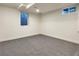 Finished room with neutral carpet, a small window and light walls at 6501 Welch Ct, Arvada, CO 80004