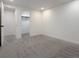 Bedroom featuring neutral carpet and a door that leads to a closet at 6501 Welch Ct, Arvada, CO 80004