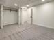 Bedroom with neutral carpet and walk-in closet, providing ample storage at 6501 Welch Ct, Arvada, CO 80004