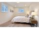 Charming bedroom bathed in natural light, featuring a comfortable bed and tasteful decor, ideal for restful nights at 6501 Welch Ct, Arvada, CO 80004
