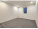 Finished room with neutral carpet, a small window and light walls at 6501 Welch Ct, Arvada, CO 80004