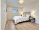 Serene bedroom with neutral tones, plush bedding, and ample natural light creating a peaceful retreat at 6501 Welch Ct, Arvada, CO 80004