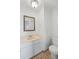 Neat bathroom featuring a vanity with a sink and toilet at 6905 Mariposa St # C, Denver, CO 80221