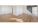 Open-concept living room with hardwood floors and plenty of natural light at 6905 Mariposa St # C, Denver, CO 80221