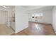 Combined kitchen and living space boasting hardwood floors and an abundance of natural light at 6905 Mariposa St # C, Denver, CO 80221
