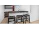 Finished basement bar area with seating and shelving next to counter at 1584 S Fraser Way, Aurora, CO 80012