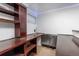 Finished basement wet bar area featuring wooden shelves, sink, and mini-fridge at 1584 S Fraser Way, Aurora, CO 80012