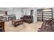 Spacious basement features a wet bar, comfortable seating, and built-in shelving at 1584 S Fraser Way, Aurora, CO 80012