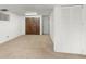 Unfinished basement with carpet, multiple small windows, and white painted walls at 1584 S Fraser Way, Aurora, CO 80012