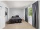 Bedroom with neutral carpet and an open window features a closet and storage at 1584 S Fraser Way, Aurora, CO 80012