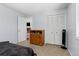 Bedroom with double-door closet, warm carpet, and natural light at 1584 S Fraser Way, Aurora, CO 80012