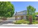 Charming two-story home featuring a well-manicured lawn, brick accents and attached two car garage at 1584 S Fraser Way, Aurora, CO 80012