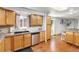 Traditional kitchen featuring wooden cabinets, granite countertops, and stainless steel appliances at 1584 S Fraser Way, Aurora, CO 80012