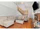 Spacious living room with hardwood floors, comfortable seating and a cozy fireplace at 1584 S Fraser Way, Aurora, CO 80012