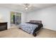 Calm bedroom with soft carpet, walk out patio and natural light at 1584 S Fraser Way, Aurora, CO 80012