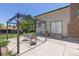 Concrete backyard patio featuring a table and seating with a pergola at 1584 S Fraser Way, Aurora, CO 80012