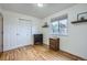 Well-lit bedroom showcasing hardwood floors, a window and closet at 6592 S Cody Way, Littleton, CO 80123