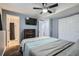 Well-lit bedroom with ensuite bathroom, ceiling fan and large closet at 6592 S Cody Way, Littleton, CO 80123