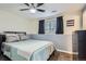 Comfortable bedroom with ceiling fan, and large window at 6592 S Cody Way, Littleton, CO 80123