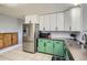 Spacious kitchen features stainless steel appliances, and ample counter space with stylish cabinetry at 6592 S Cody Way, Littleton, CO 80123
